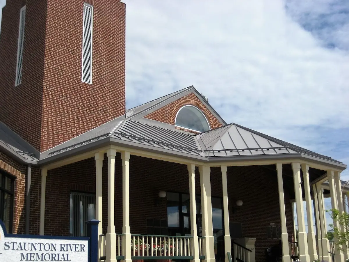 Skilled roofing craftsmen working on a residential roof in Swannanoa